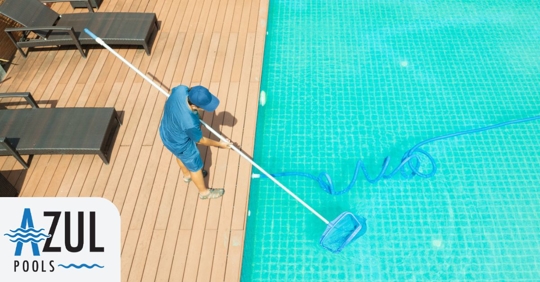 Technician doing pool maintenance